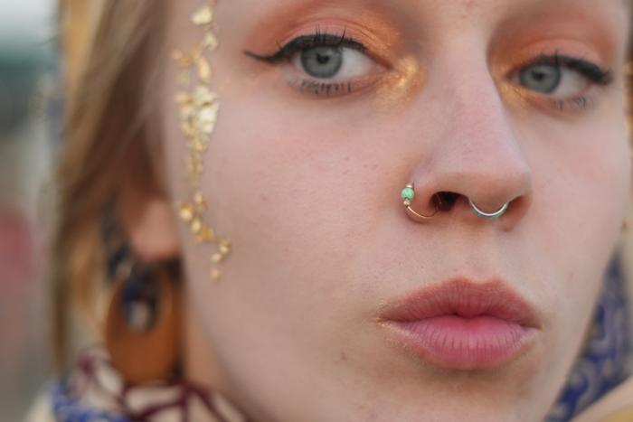 woman close-up eyes earring headscarf