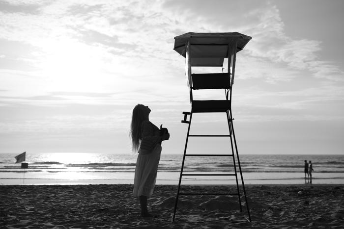 B&W lifeguard tower and woman wide