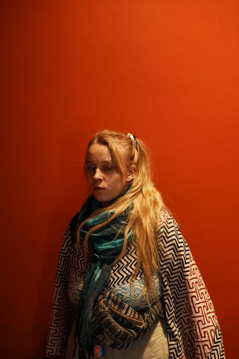 woman against red wall
