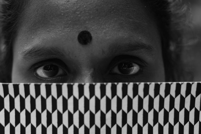 conceptual eyes bindi over checker pattern