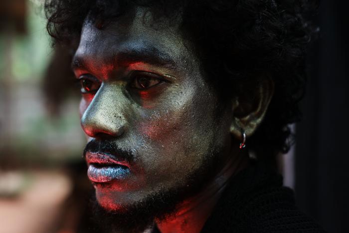 man red face paint portrait