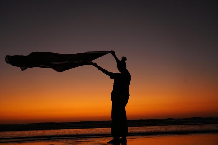 silhouette scarf flowing sunset