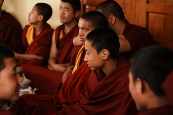 young monks laughing candid