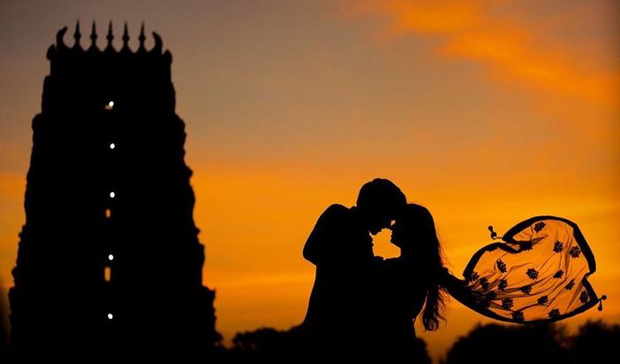 temple silhouette couple sunset